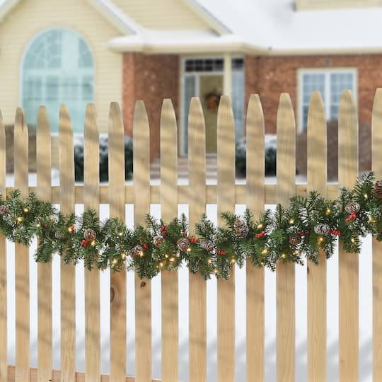 9' x 10" Pre-lit Glittery Mountain Spruce Artificial Christmas Garland with White Edged Cones, Red Berries and 50 Clear Lights